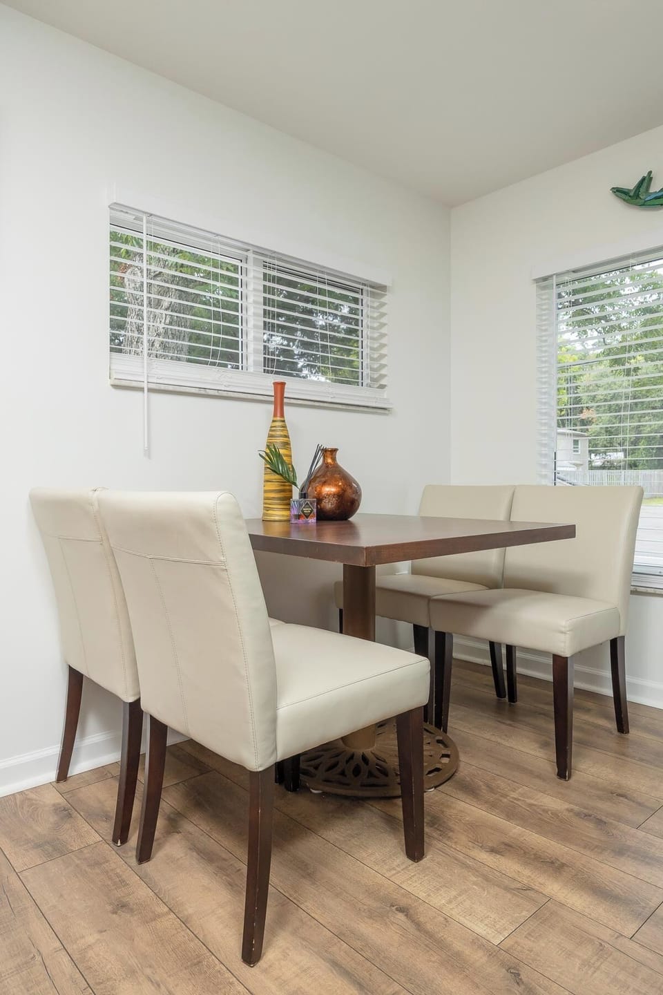 Bright dining nook with seating for four and abundant natural light