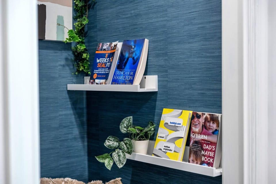 A cozy reading corner awaits — read our collection or bring your favorites!