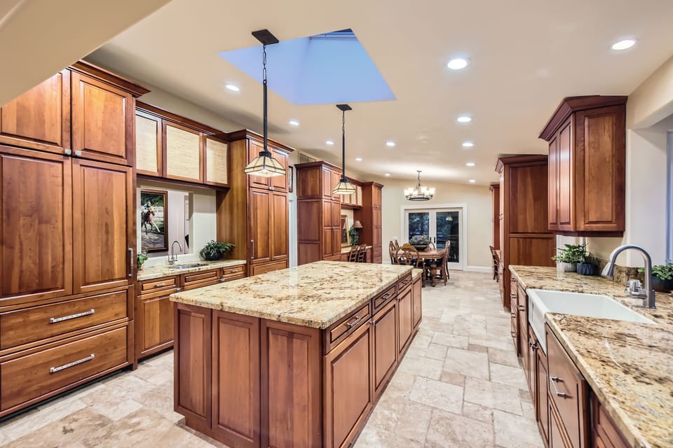Spacious kitchen with two sinks and sub zero refrigerator.
