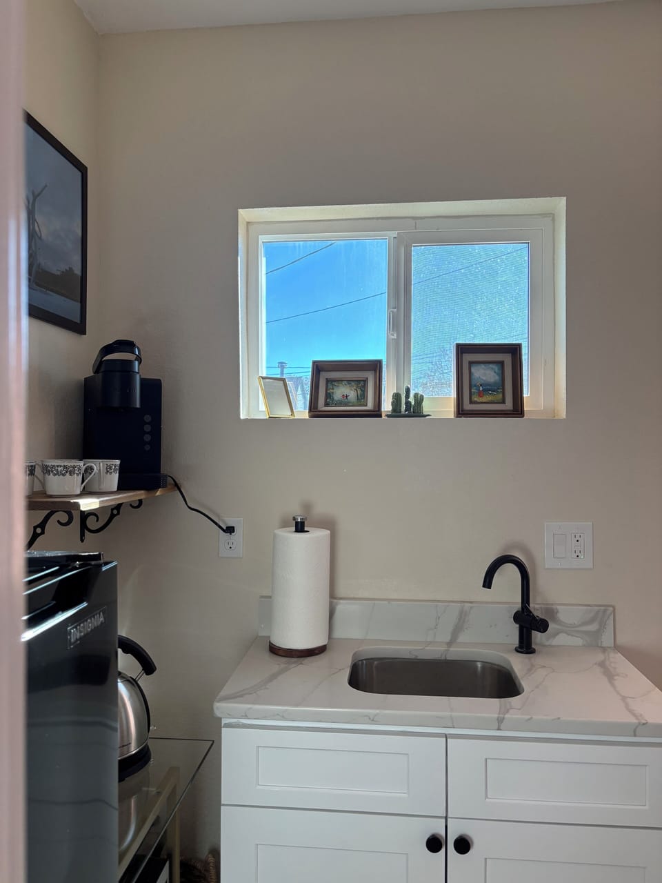 Privacy film on windows.Kitchenette has mini fridge, mini microwave, H2O kettle