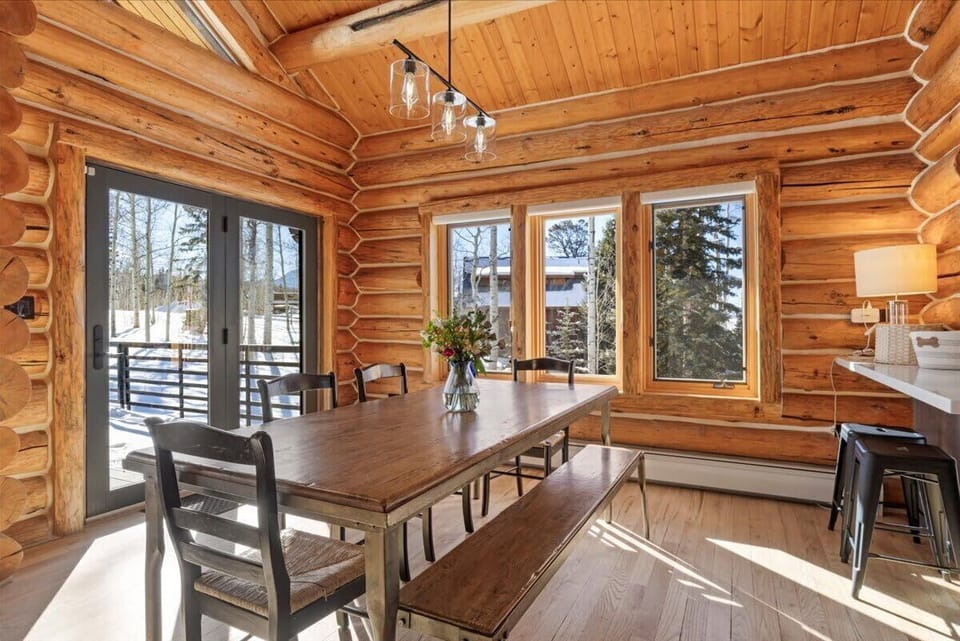 Dining area (main floor): Dining table seats 8, 2 barstools at counter