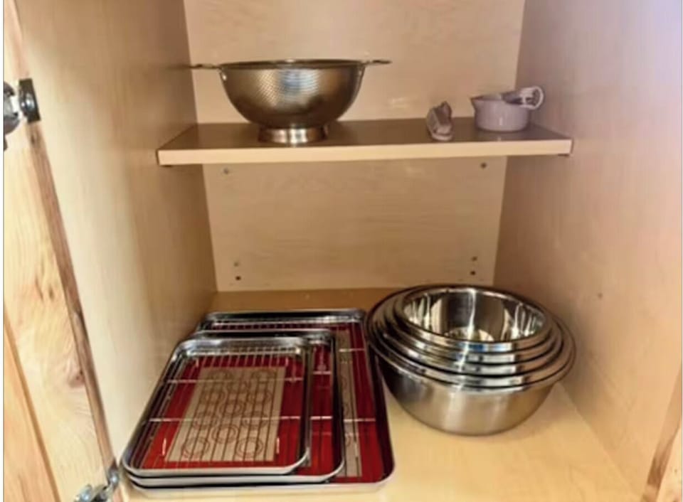 Stainless steel pots, strainer, and baking sheets.l 