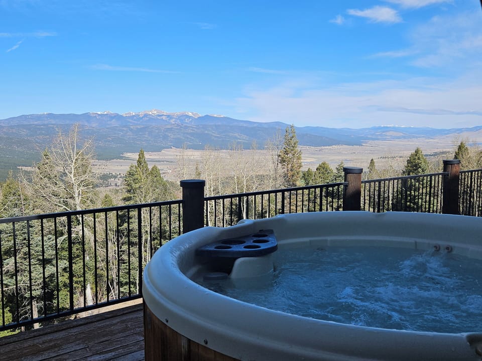 Enjoy the outdoor hot tub with views of New Mexico's highest mountain peak