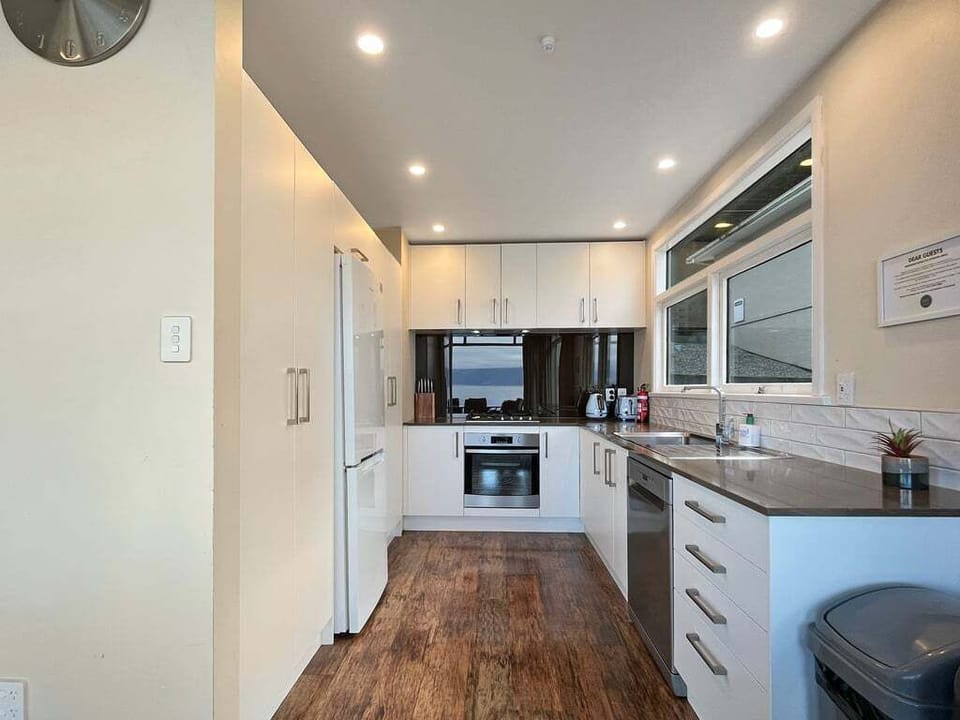 Fully equipped kitchen with modern appliances and generous storage