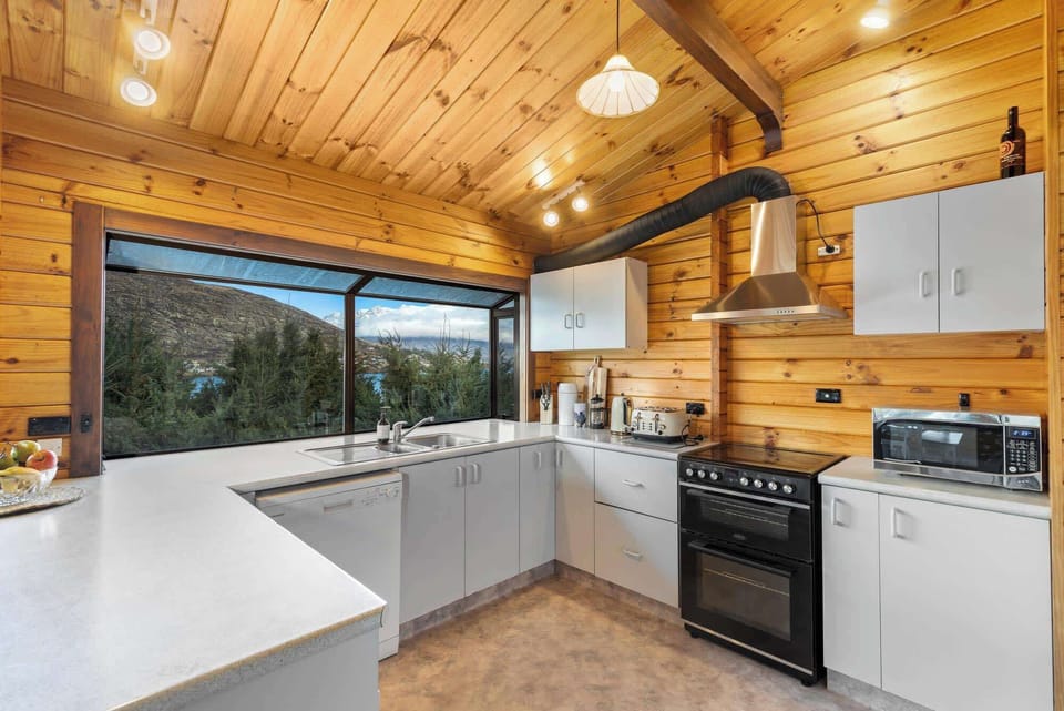 Fully equipped kitchen with expansive windows