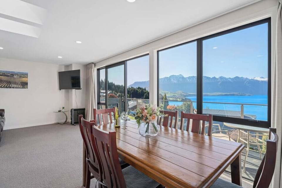 Dining area opening onto the balcony, perfect for meals with a lake view