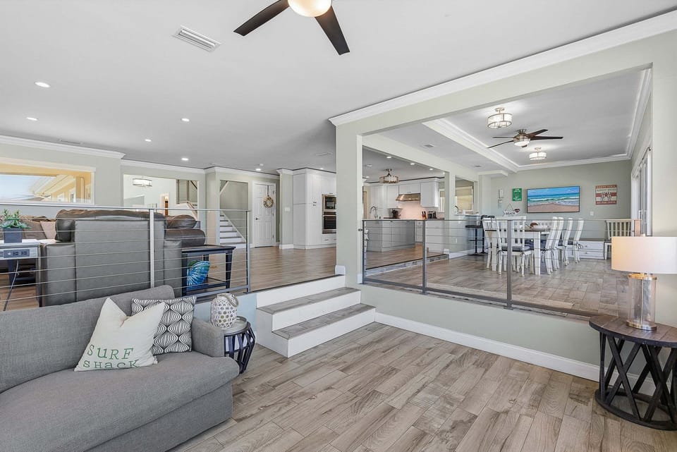Enjoy this spacious open-concept layout connecting lounge, dining, and kitchen areas. Perfect for your beach stay, this bright coastal home offers plenty of room to gather, relax, and unwind after a day by the ocean.