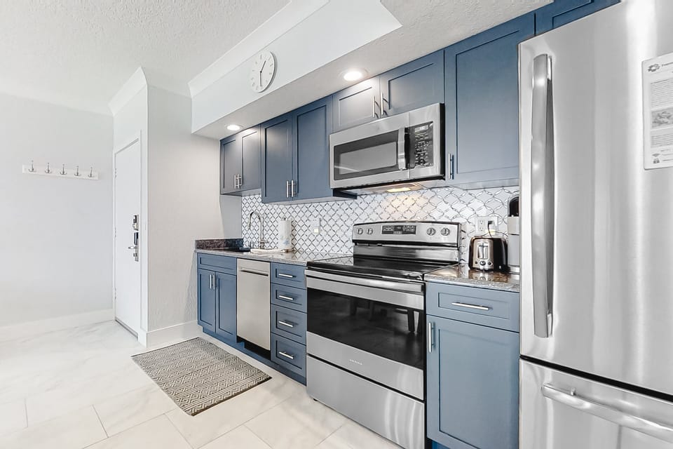 Enjoy a bright, fully equipped kitchen designed for a relaxing beach stay. Featuring modern appliances, coastal cabinetry, and stylish finishes, it's perfect for preparing meals after a sun-soaked day by the ocean.