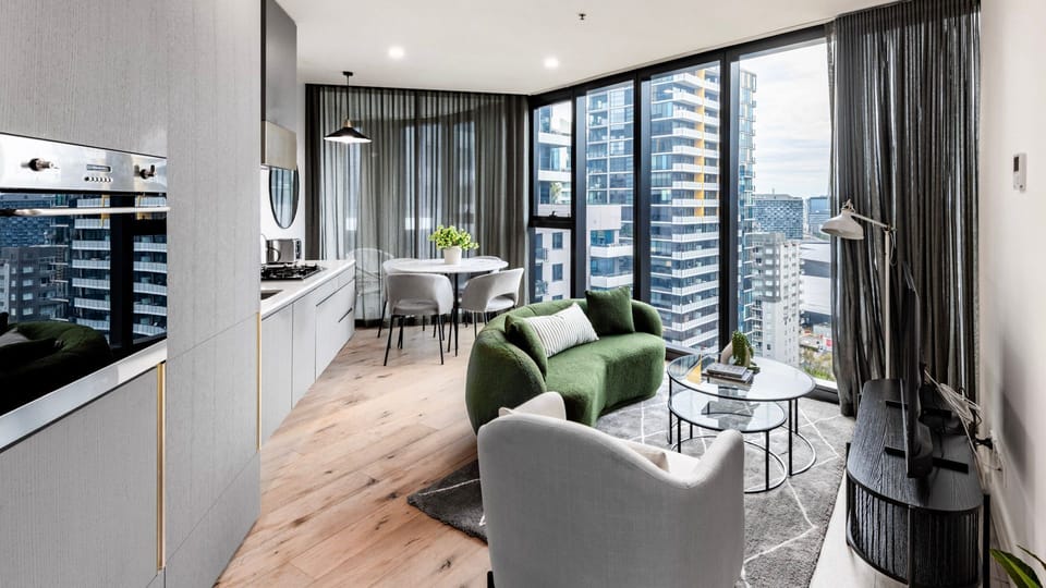 Open-plan living and dining area with modern finishes and skyline outlook.