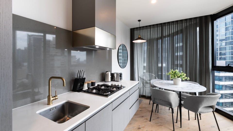 Stylish kitchen with premium appliances and sleek stone benchtops.