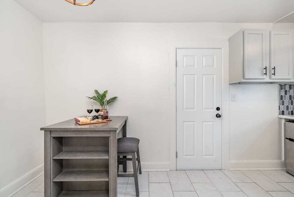 Unit 1: Essentially equipped kitchen, complete with stainless-steel appliances and a dining area for 2 guests.