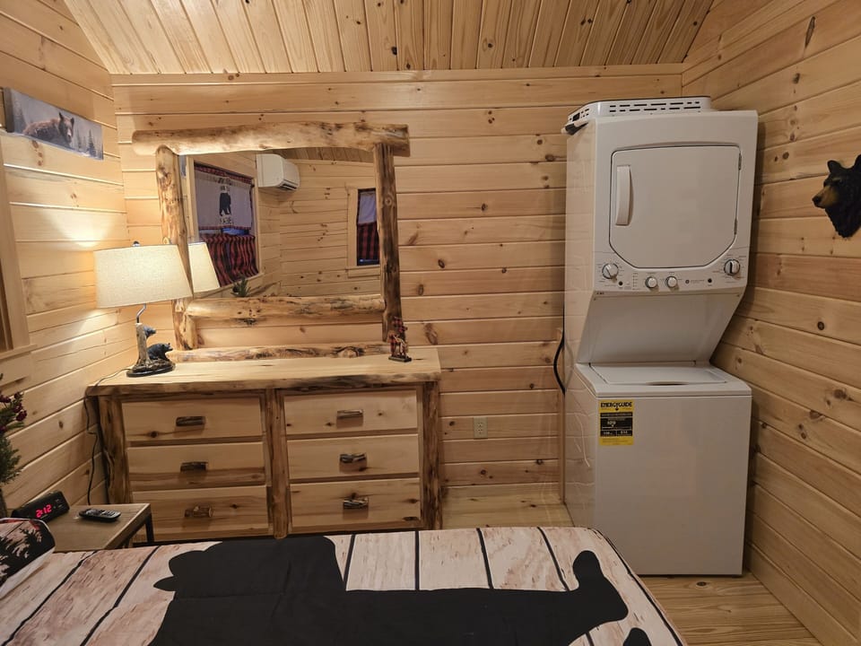 Bedroom with washer and dryer. 