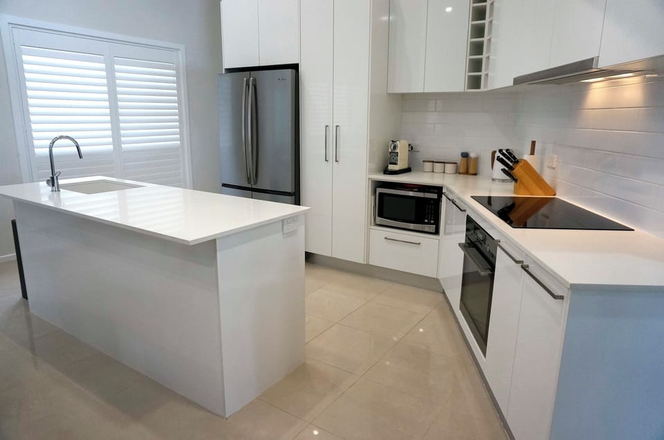 Gourmet fully equiped kitchen with coffee machine with tea and coffee supplies