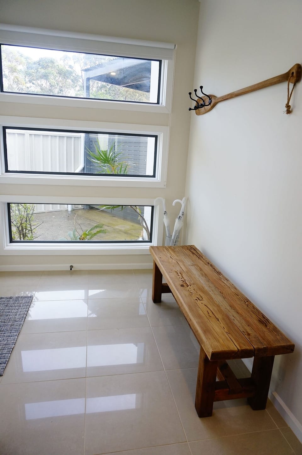 Entrance seat, coat hooks and umbrellas