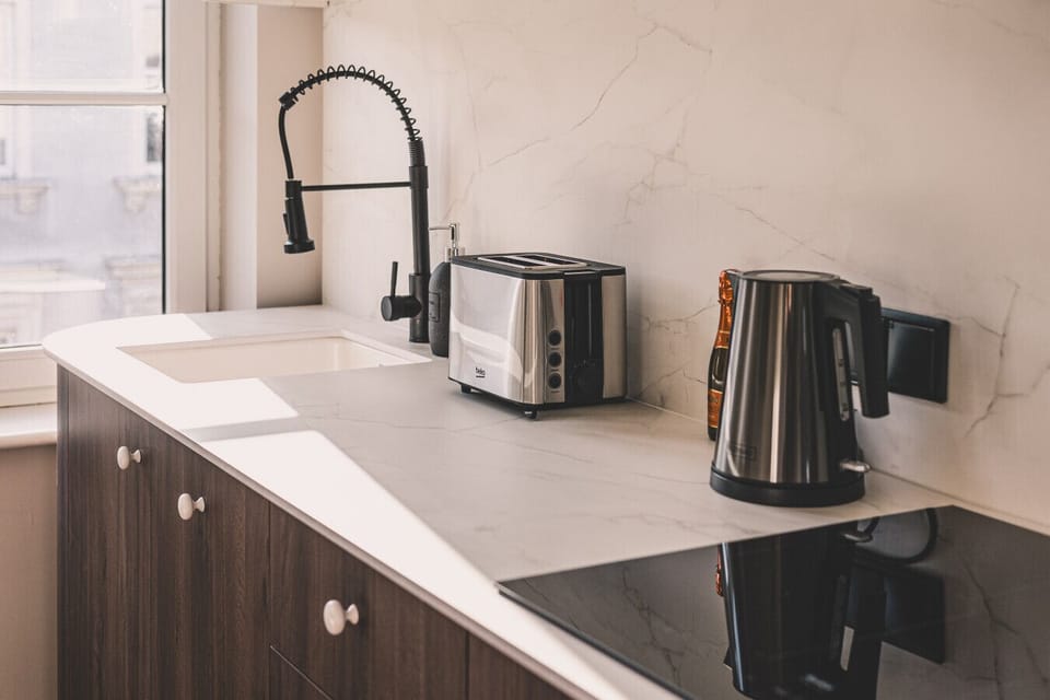 Everything you need – kettle, toaster, and a stylish spot for morning coffee.
