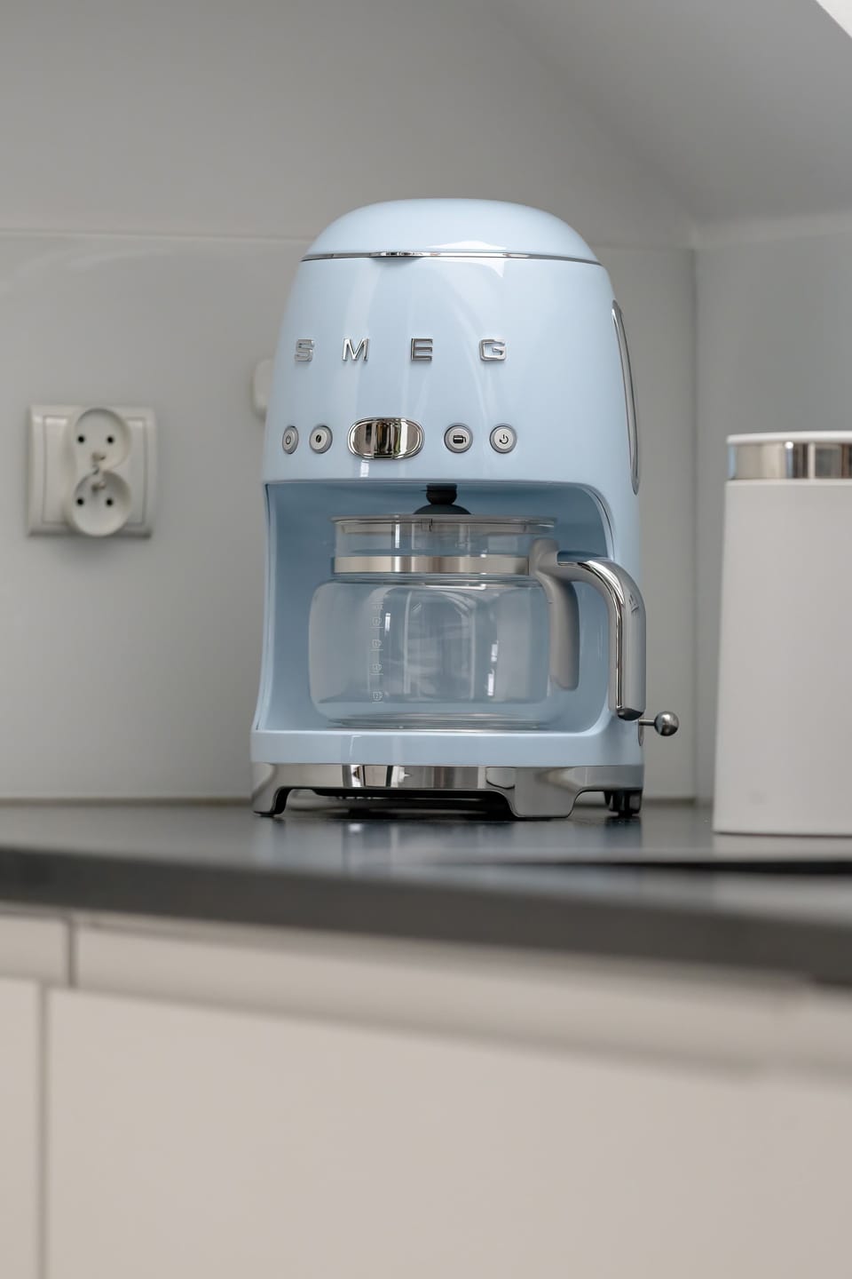 A small countertop with a compact appliance. The clean setup suggests functionality and modern living.