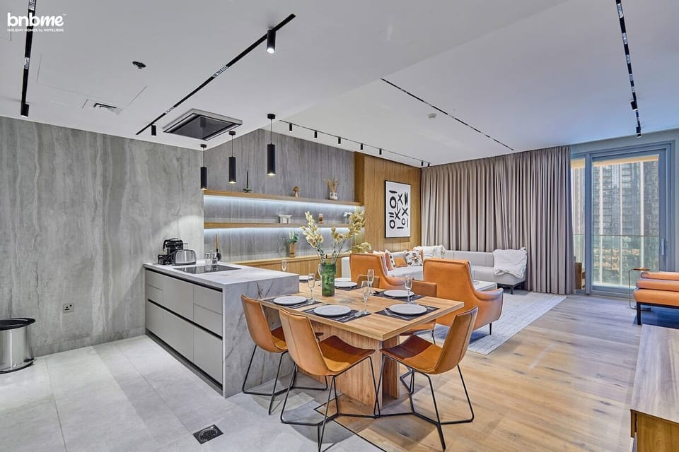 Gather for meals in the stylish dining area, perfect for enjoying delicious food and great company.