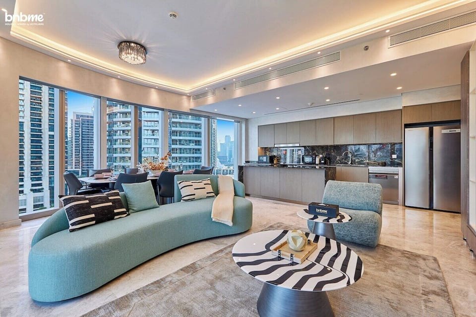 Bright and spacious, with plush seating and a large TV for cosy nights in. Floor-to-ceiling windows allow natural light to flood the room.