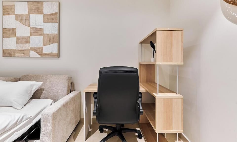 Quiet, multi-purpose study with a desk, ergonomic chair, and sofa bed, perfect for working remotely or accommodating an extra guest. Designed for comfort, privacy, and productivity during your Dubai stay.