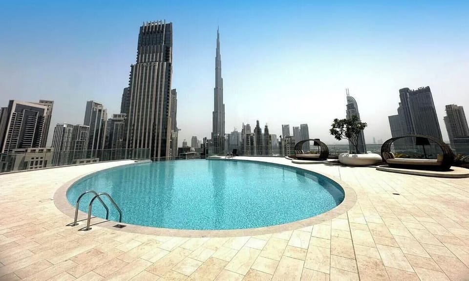 Unwind in the stunning infinity pool overlooking the Burj Khalifa and Dubai skyline. Perfect for a refreshing swim or sunset relaxation with panoramic city views, your private oasis above Downtown Dubai.