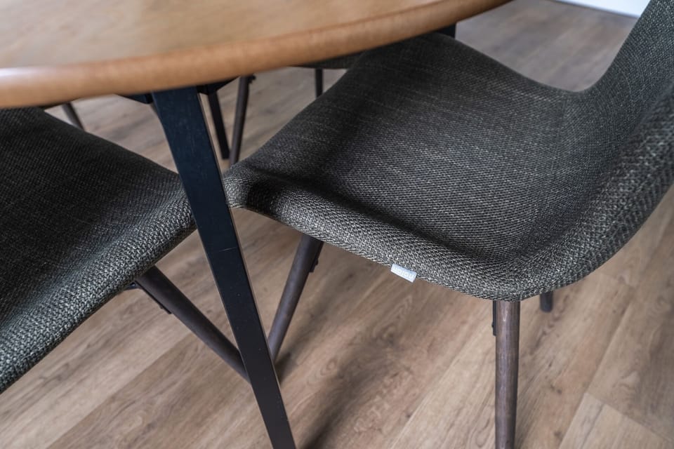 Comfortable dining chairs create the perfect setting for meals, coffee breaks, or remote work.