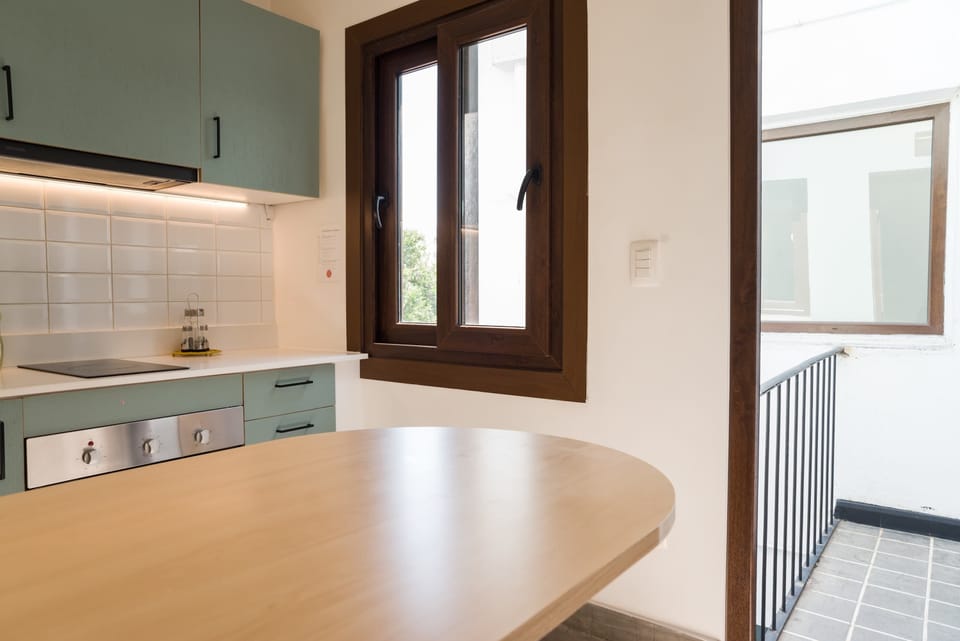 Cozy kitchen with modern amenities and natural light, perfect for preparing meals during your stay.