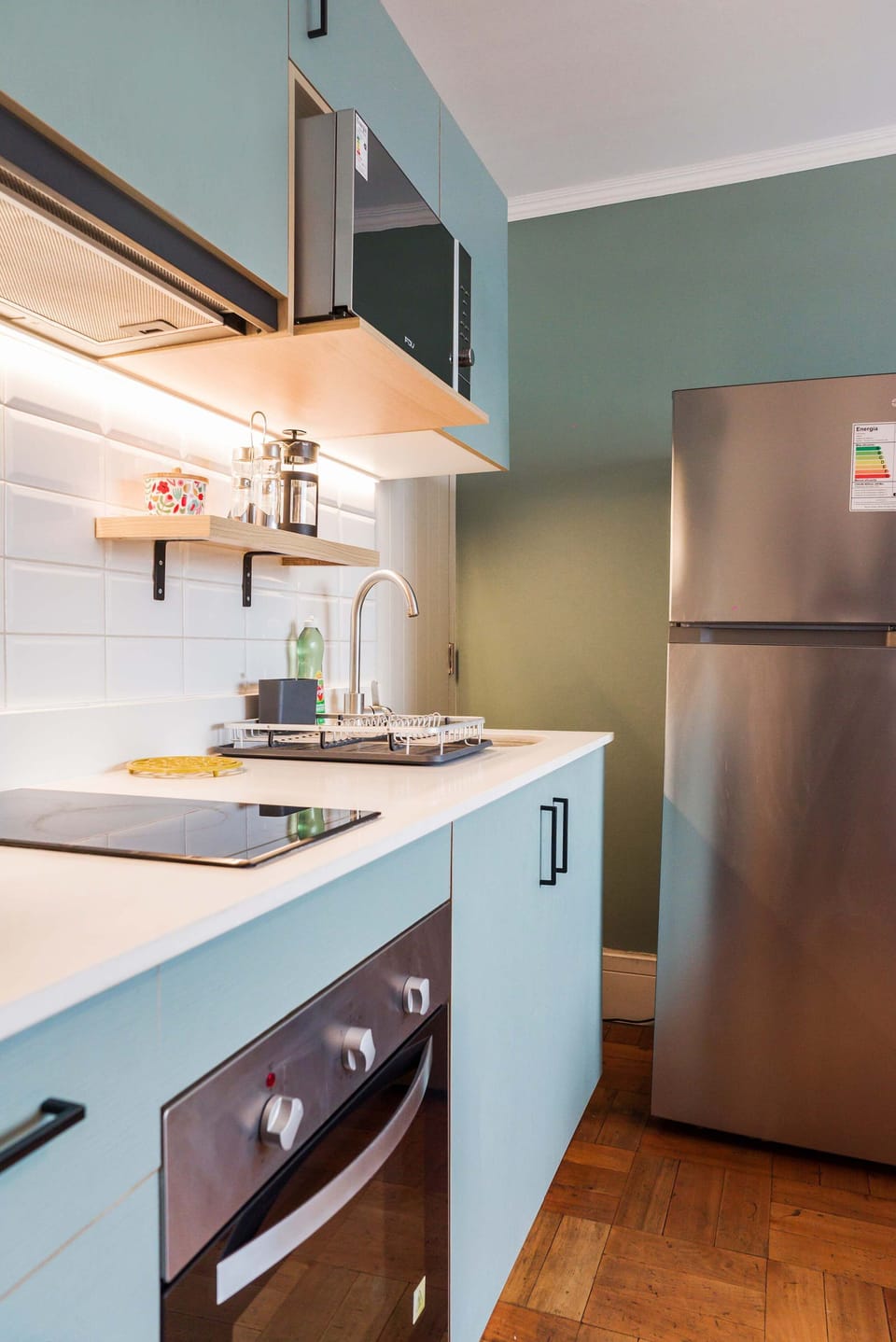 Modern and efficient kitchen with sleek appliances and stylish design, perfect for preparing meals during your stay.