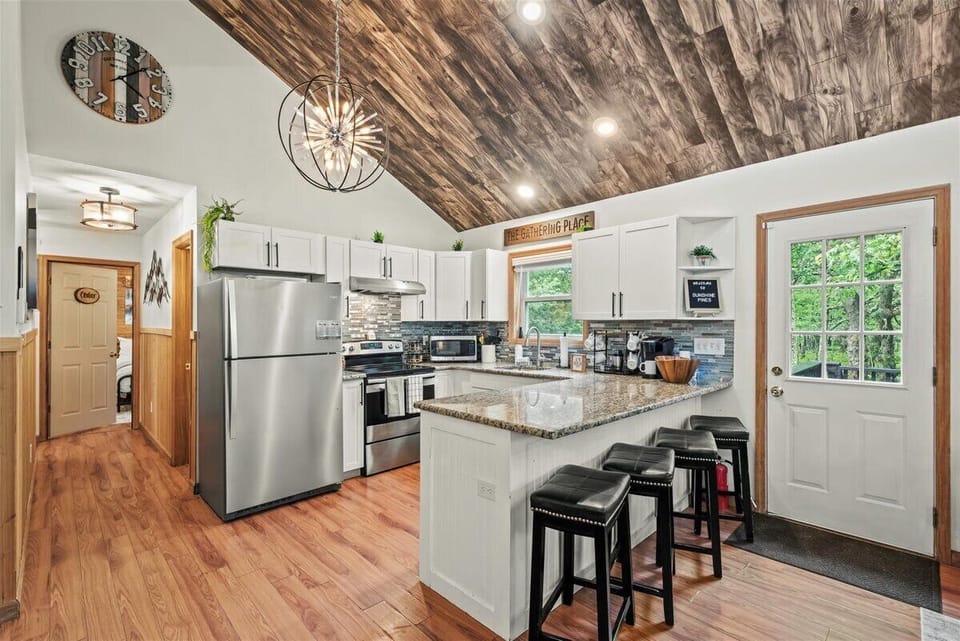The heart of the home — granite island seating, stainless appliances, and everything you need for memorable meals together.