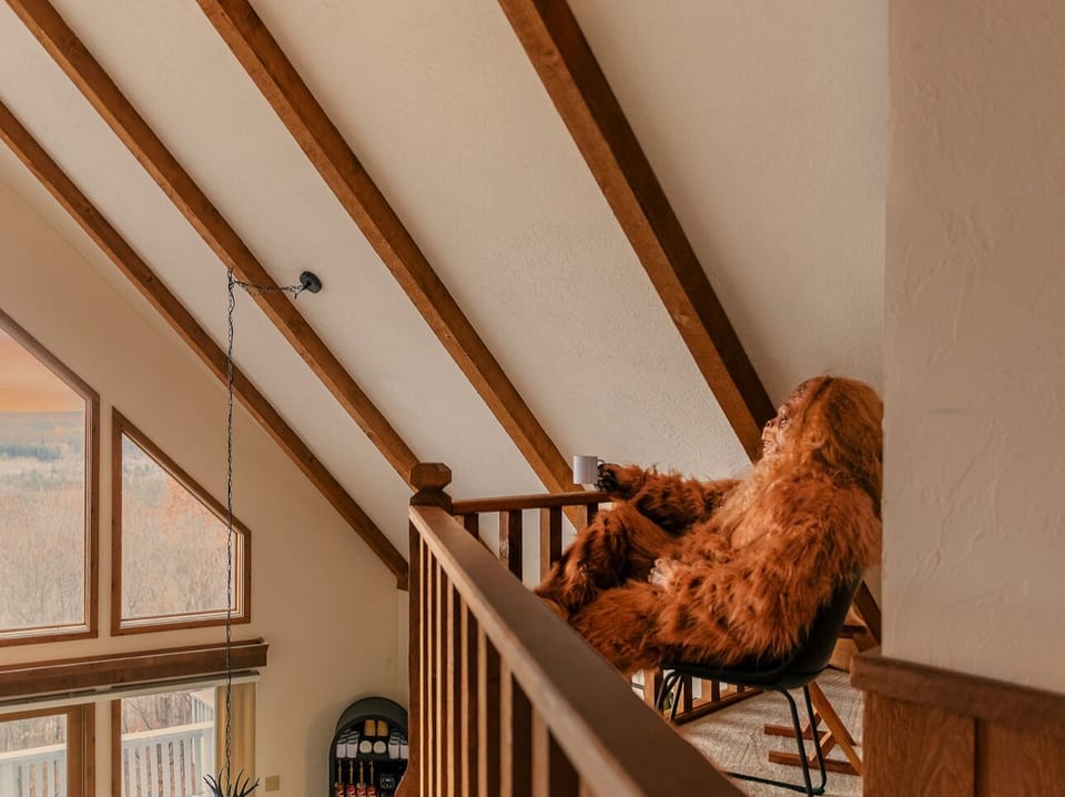 Cozy loft retreat with comfy seating and top-floor views—Bigfoot’s quiet escape