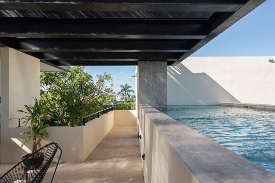 Rooftop pool with refreshing vibes, sun, and beautiful views to relax.