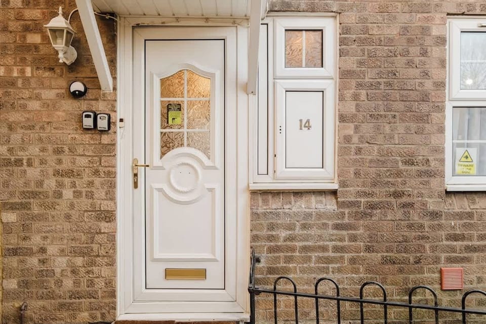 A welcoming entrance with a charming front door and a neat exterior.