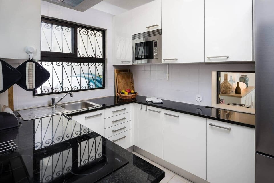 Fully equipped kitchen with an induction stove and oven 