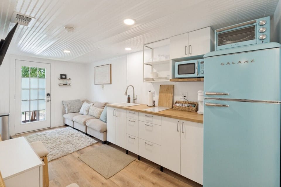 View of well appointed kitchenette, lounge area & convertible dining