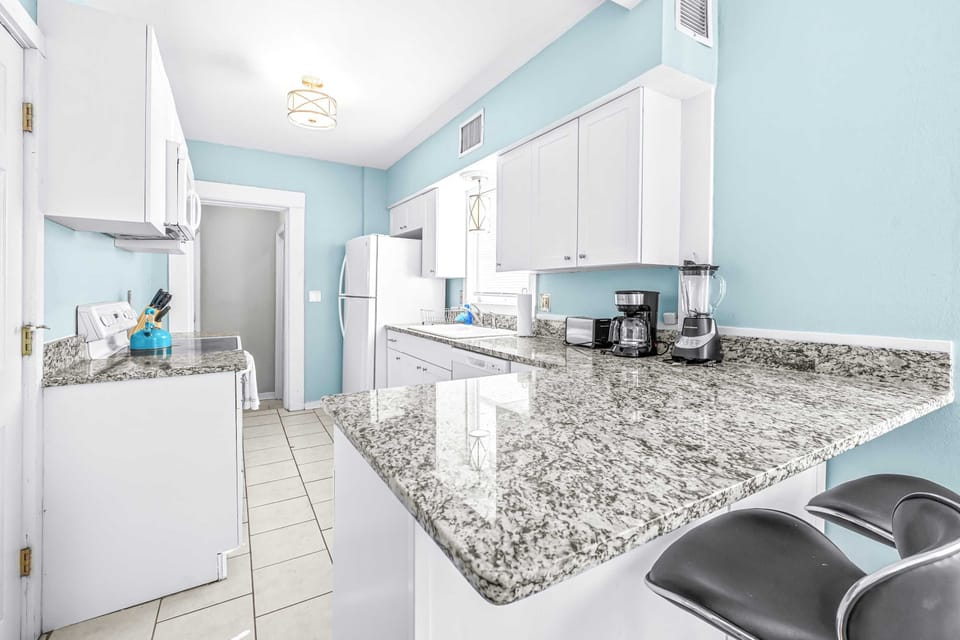 The open kitchen is well equipped for an unforgettable getaway​