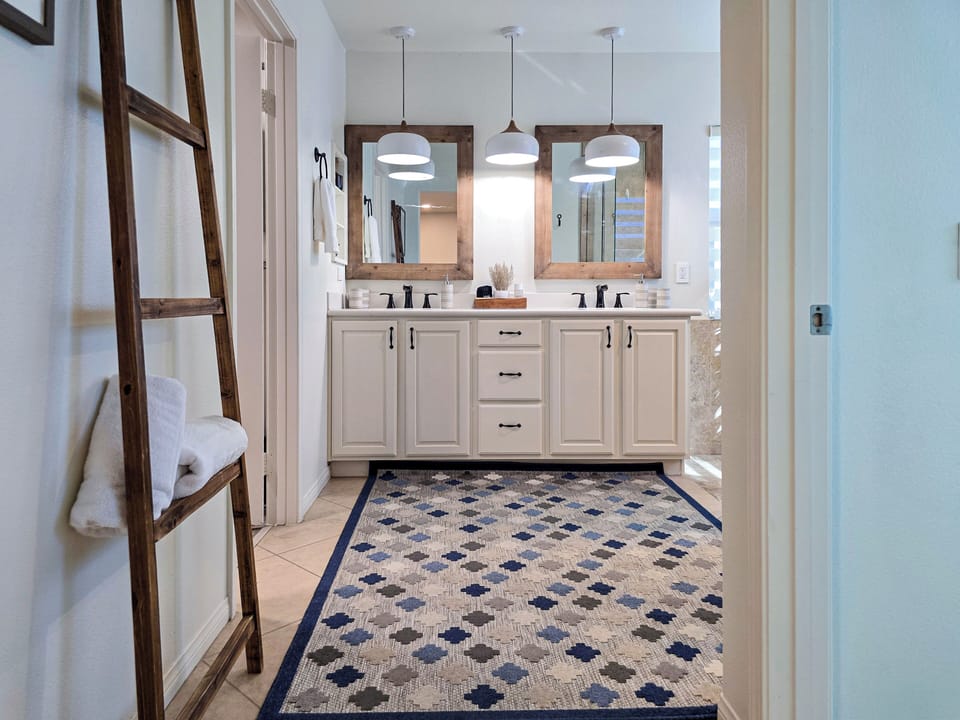 Ensuite bathroom #3 with double vanity and large walk-in closet.