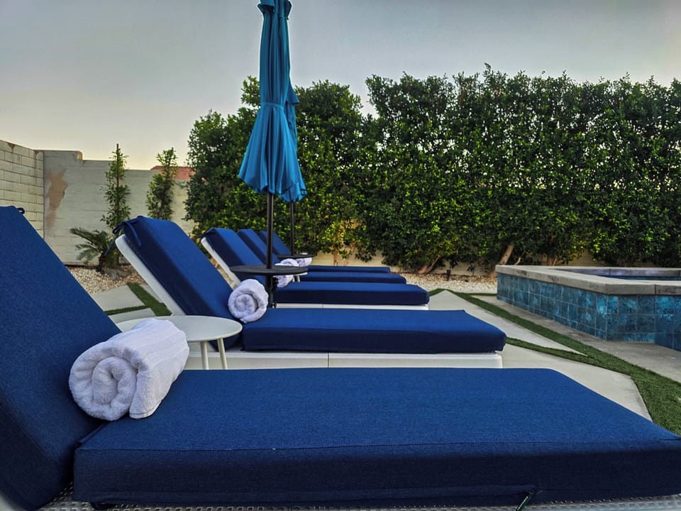 Comfortable padded loungers and umbrellas.