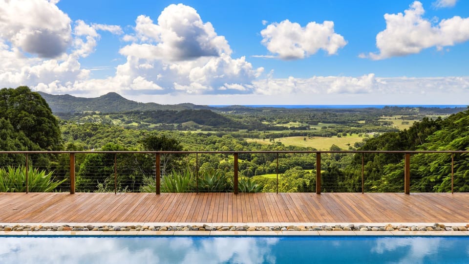 Poolside views stretching across the valley to the ocean.