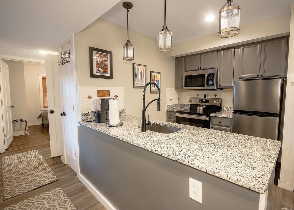 Cook with ease in the modern, fully stocked kitchen complete with stainless steel appliances.