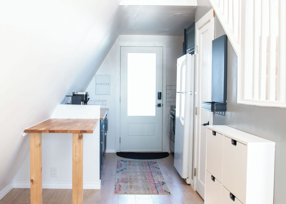 Step through the front door and into a small, fully stocked kitchen