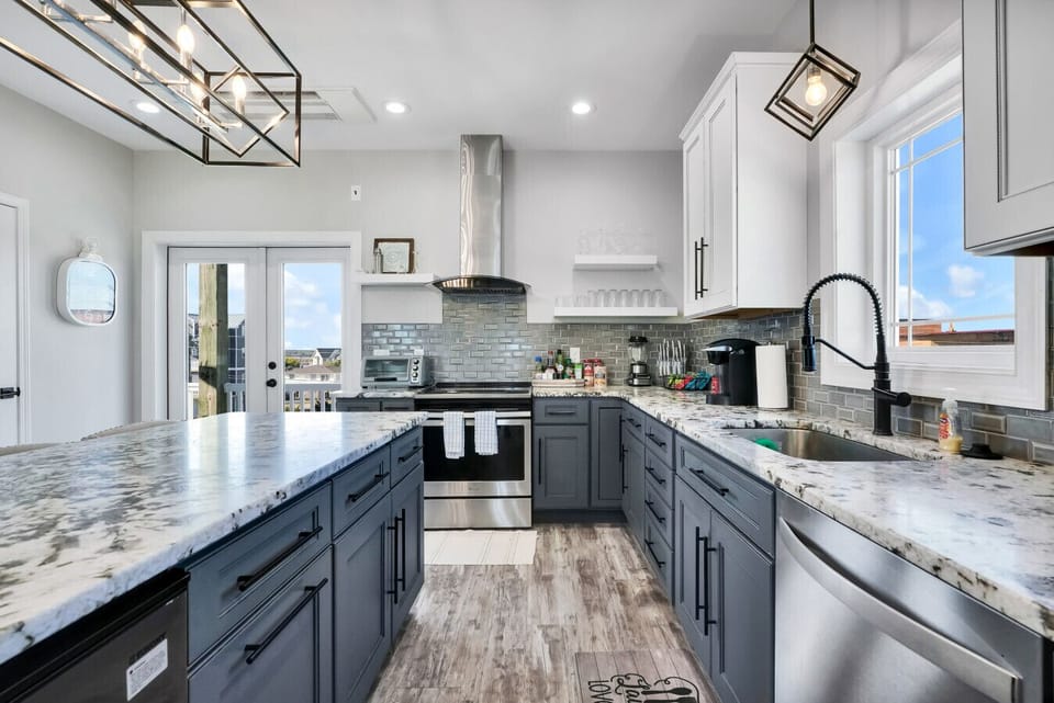 Kitchen | Modern Design with Marble Counters & Stainless Appliances