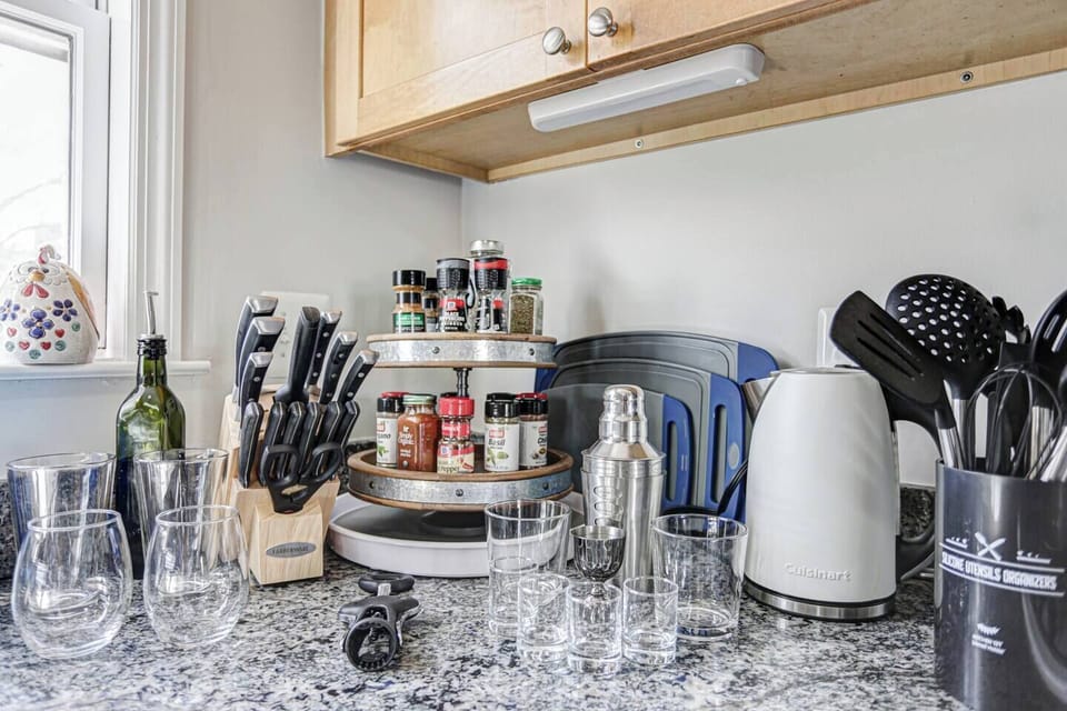 Full selection of cooking utensils, knives, glasses and barware, plus a kettle