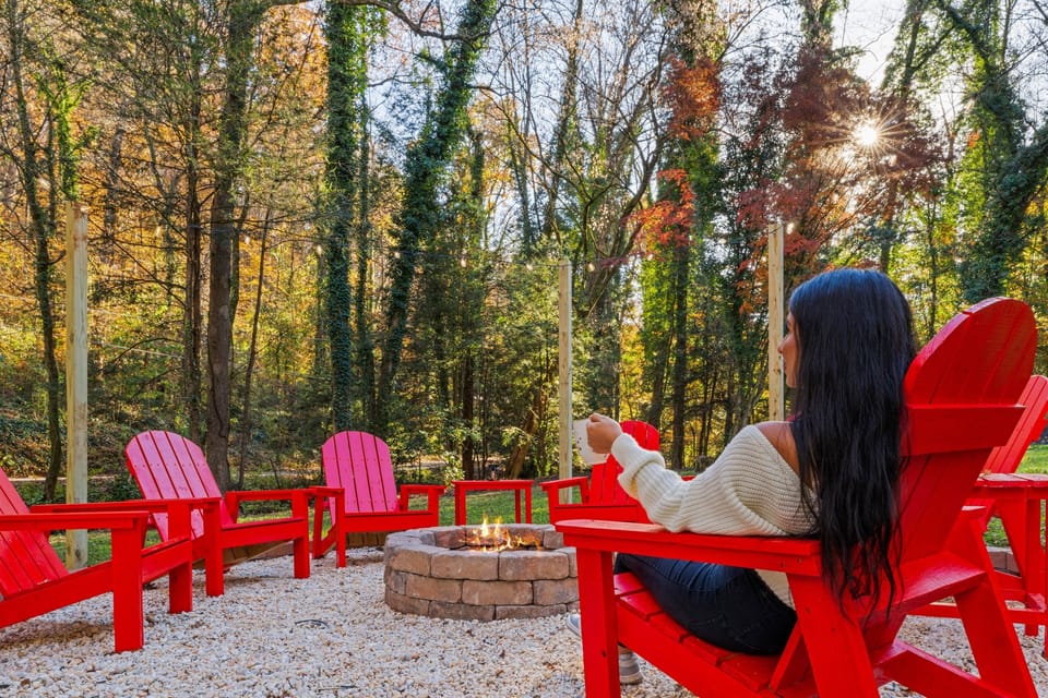 Enjoy the fire pit even during the day as you relax in this peaceful outdoor space surrounded by trees and natural light.