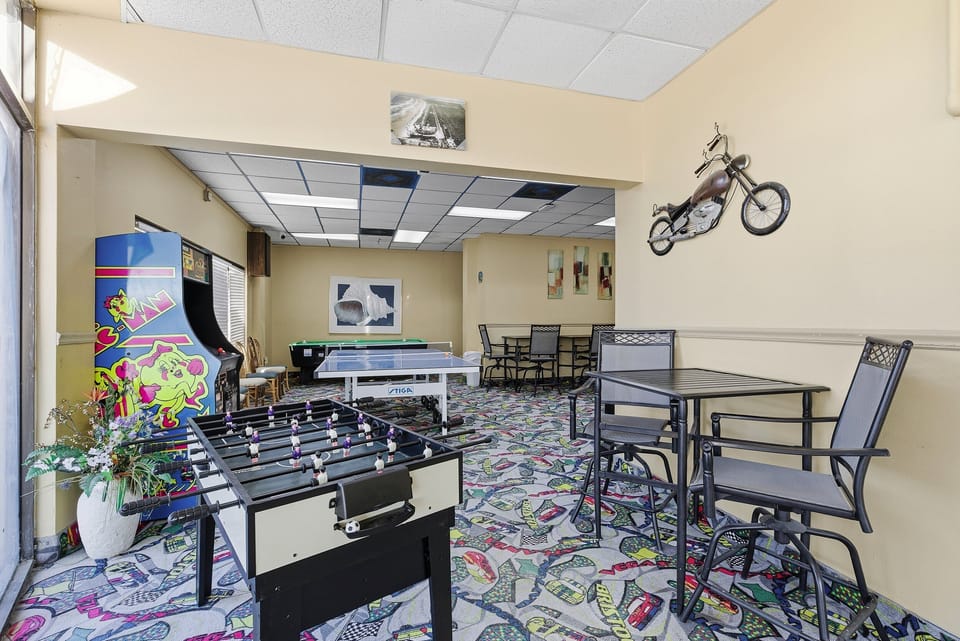 Enjoy downtime in this on-site game room featuring foosball, ping pong, and arcade games. A fun bonus for your beach stay, offering entertainment for all ages after a day at the beach, pool, and ocean adventures.