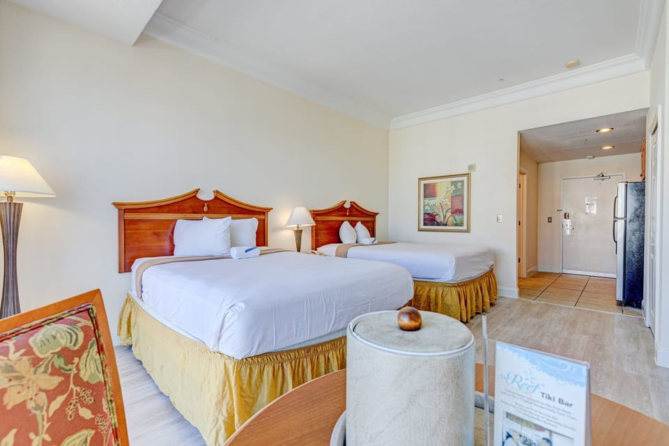 Cozy double-bed room perfect for your beach stay, featuring soft lighting, fresh linens, and easy access to the shoreline. Ideal for relaxing after a day of oceanfront fun.