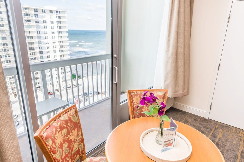 Enjoy a cozy beach-stay dining spot with bright ocean views from your private balcony. Perfect for morning coffee or relaxing after a day on the sand.