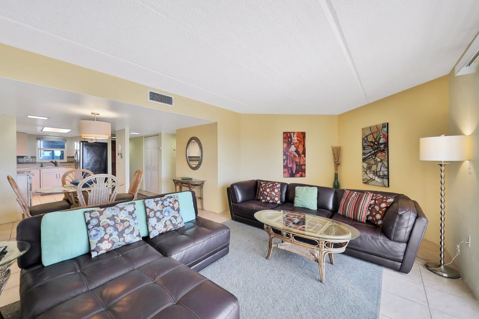 Enjoy this spacious open-concept beach stay featuring a comfortable living room, dining area, and easy flow to the kitchen. Coastal décor and inviting seating make it ideal for relaxing after a fun-filled day at the beach.