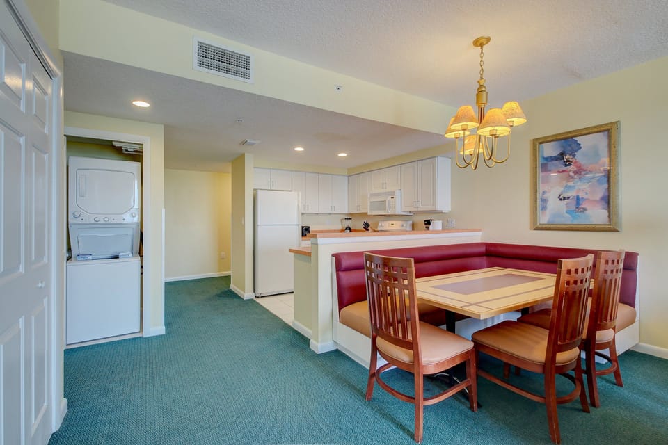 Spacious dining nook and fully equipped kitchen make mealtime a breeze during your beach stay. Enjoy convenience with in-unit laundry and plenty of room to gather after a day by the ocean.