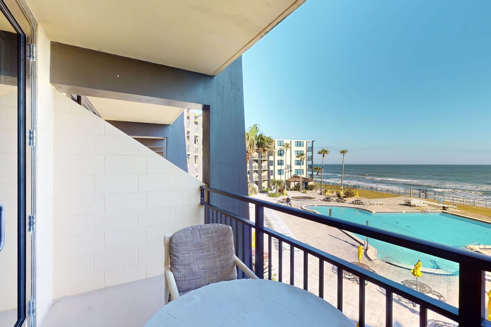Soak in your beach stay from this private oceanview balcony overlooking the beachfront pool and shoreline. Enjoy sea breezes, sunshine, and relaxing coastal views—perfect for morning coffee or unwinding after a day at the beach.