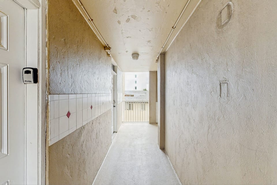 Convenient exterior hallway providing easy access to your beachfront studio. Designed for a smooth arrival and departure during your beach stay, just moments from ocean views, sand, and coastal attractions.