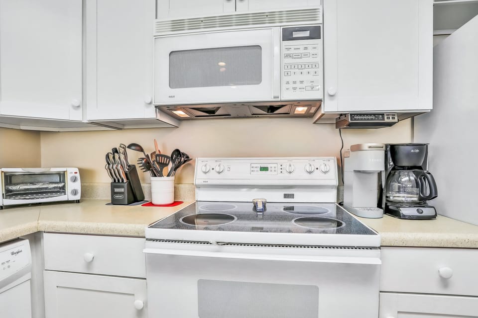 A well-equipped kitchen with modern appliances, cookware, and coffee options—perfect for preparing meals during your beach stay. Convenient, clean, and ready for your seaside getaway.